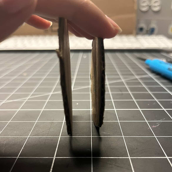 This image shows that we need to have something inbetween the gears to keep them from falling through the holder. We decided to add a piece of cardboard in between each gear to provide stability and ensure they stayed in place while rotating.