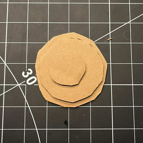 This was the starting point for our first attempt at prototyping our exercise band concept. We got cardboard and cut out circles to see if we could actually create the gears out of cardboard. This helped us understand the dimensions and mechanics of the gears we wanted to create.