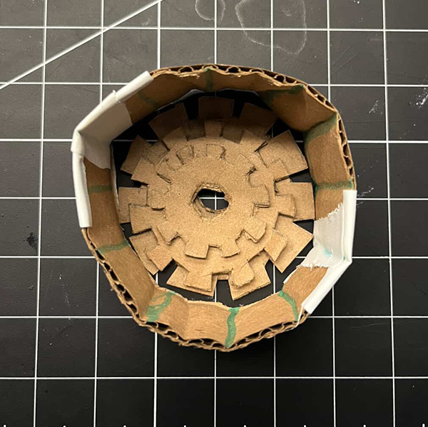 This is showing how the gears would look when placed in the holder. We tested the rotation of the gears to see if they meshed well and could turn smoothly without any obstructions.
